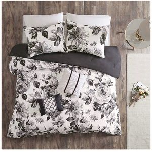 A black and white floral coverlet bedding set